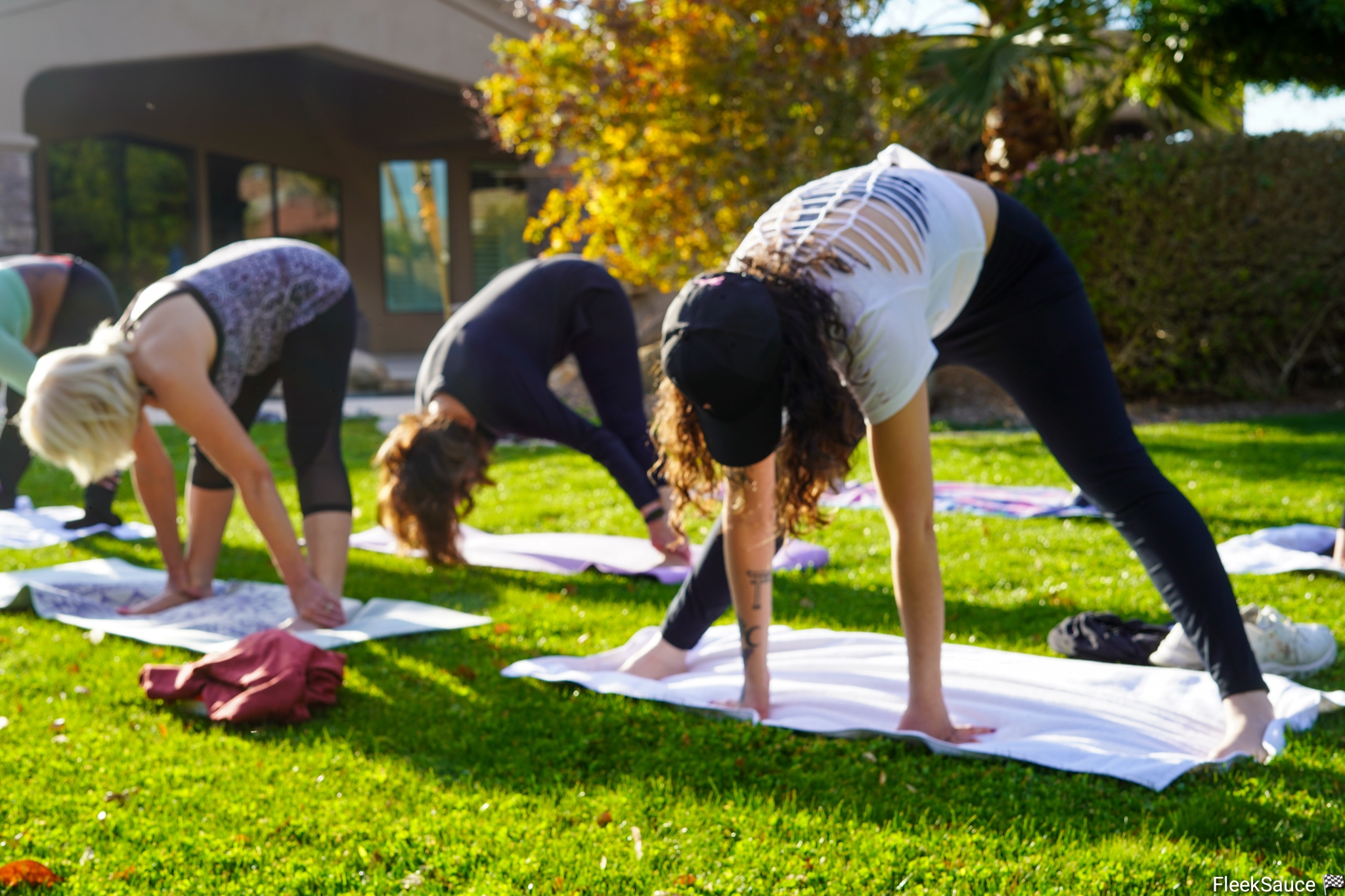 Group yoga session outdoors demonstrating our holistic wellness approach